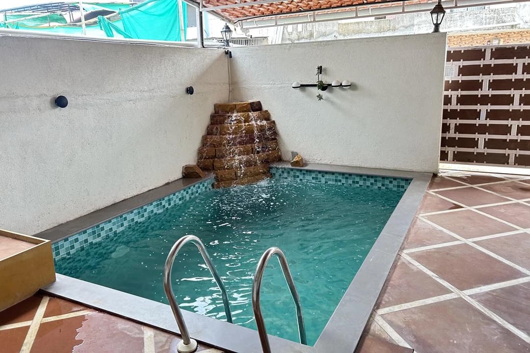 Private swimming pool with a terracotta deck at a coastal villa