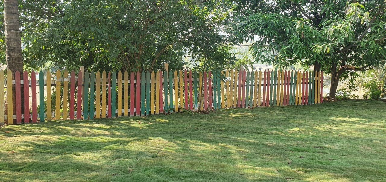 Garden with hammocks and swings under trees at a rural farmhouse