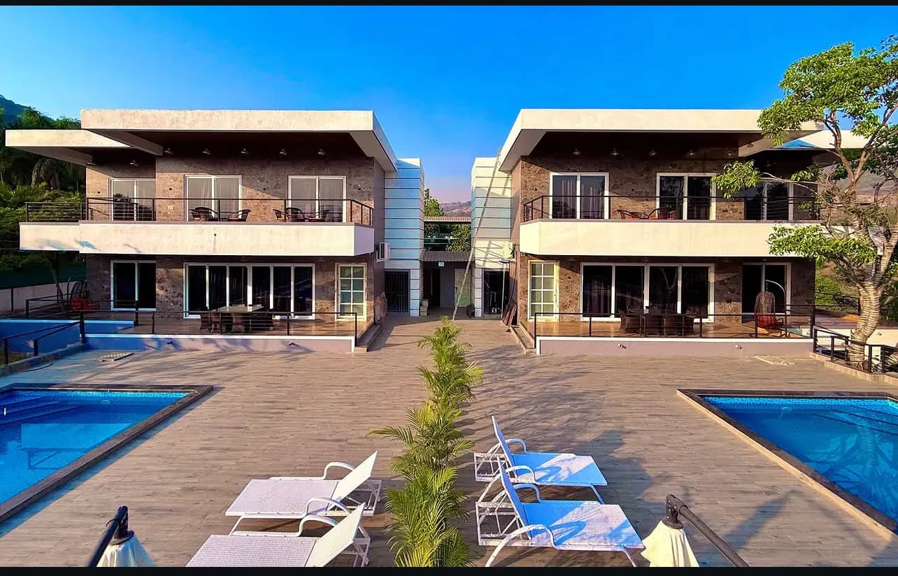 Villa exterior with a private pool and loungers near Pawna, Lonavala